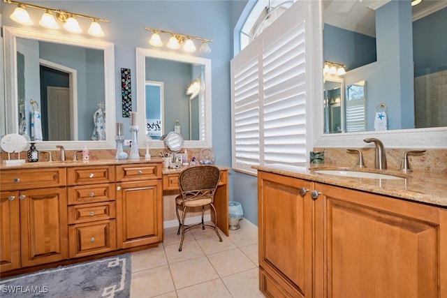 bathroom featuring vanity, tile patterned floors, and crown molding