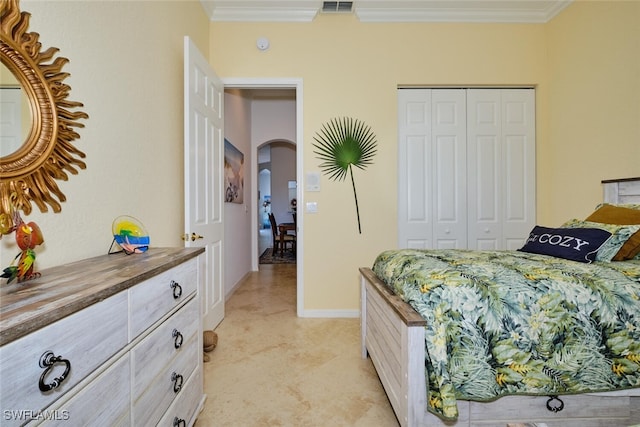 bedroom featuring a closet and ornamental molding