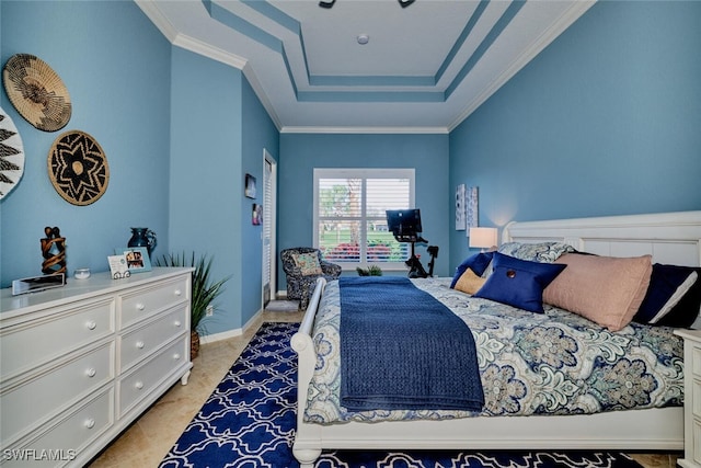 bedroom featuring a raised ceiling and ornamental molding