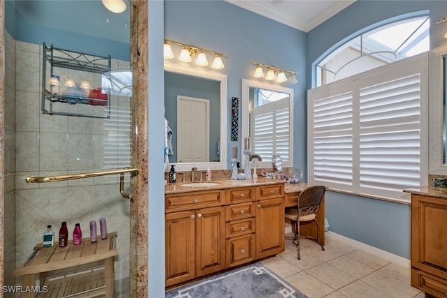 bathroom with tile patterned flooring, vanity, a shower with shower door, and ornamental molding