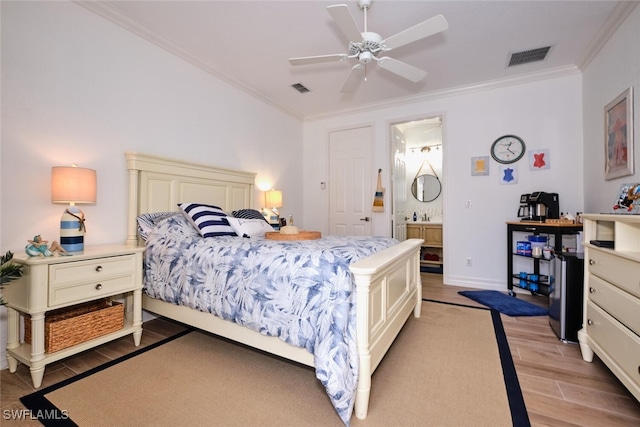 bedroom with connected bathroom, light hardwood / wood-style flooring, ceiling fan, and ornamental molding