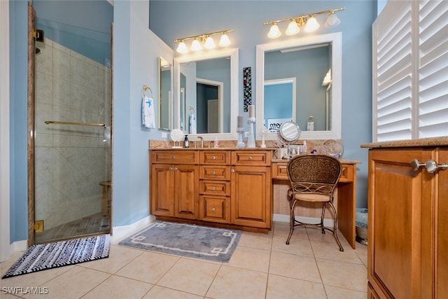 bathroom with tile patterned floors, vanity, and a shower with shower door