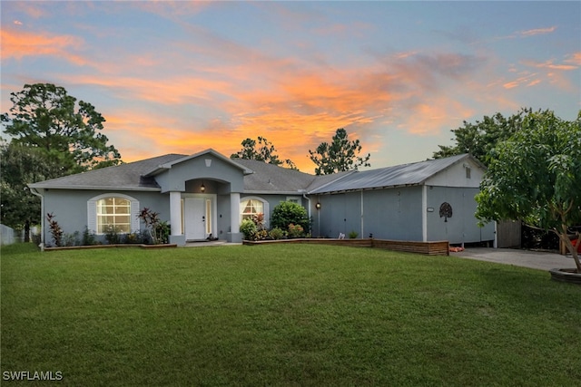 ranch-style house with a lawn