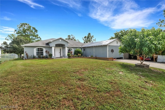 ranch-style home with a front yard