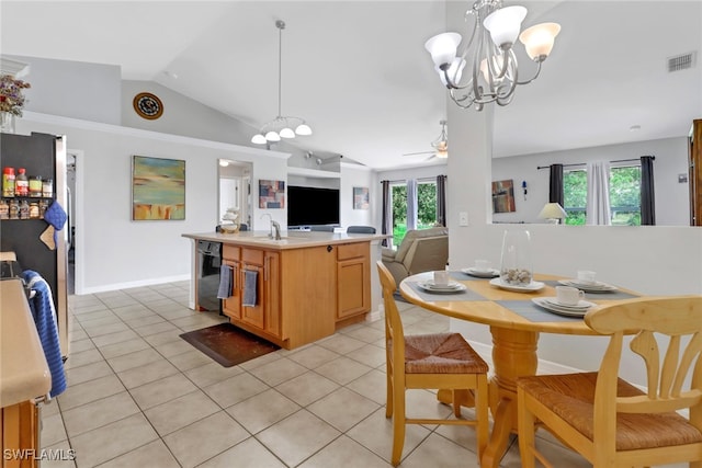 kitchen with a healthy amount of sunlight, black dishwasher, vaulted ceiling, and a kitchen island with sink