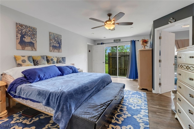 bedroom featuring hardwood / wood-style flooring, ceiling fan, and access to exterior