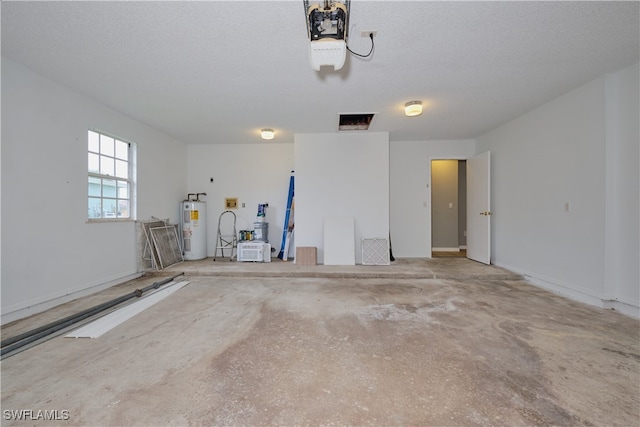 garage featuring a garage door opener and electric water heater