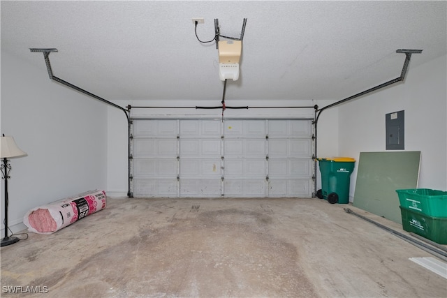garage with a garage door opener and electric panel