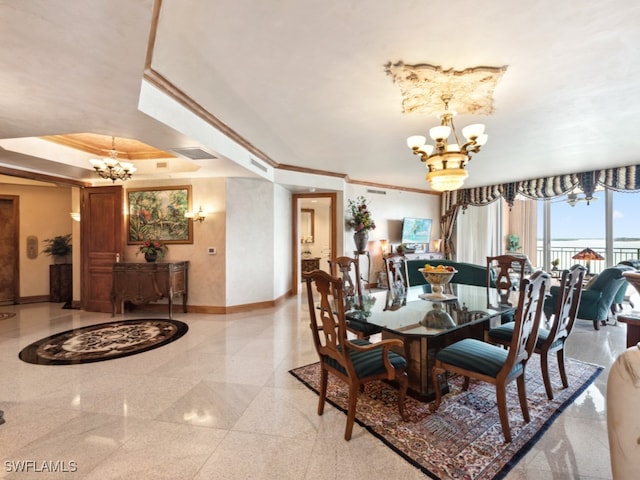 dining area with a raised ceiling, crown molding, and a notable chandelier