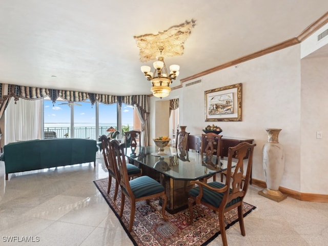 dining space with ornamental molding