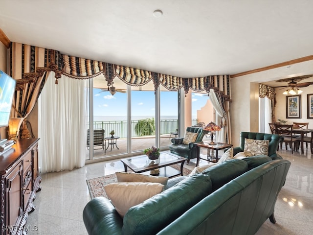 living room with ceiling fan and a water view