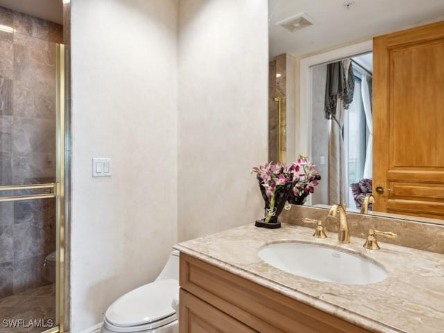 970 Cape Marco Dr Unit 402, Marco Island, FL 34145 - bathroom with toilet, vanity, a shower stall, and visible vents