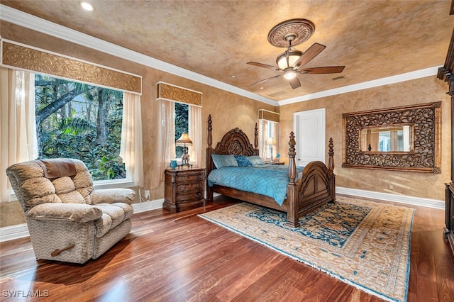 bedroom with crown molding, ceiling fan, and hardwood / wood-style flooring