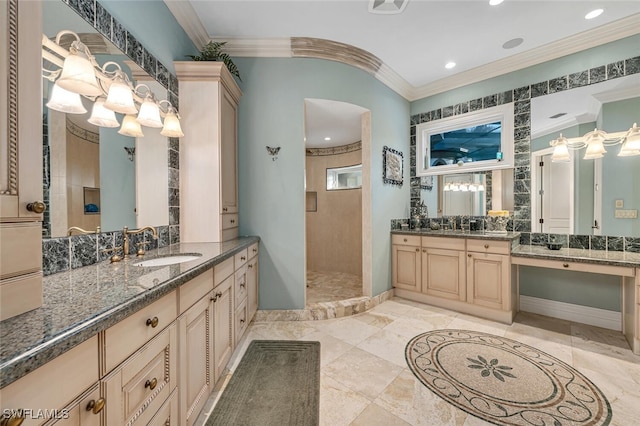 bathroom with crown molding, a shower, and vanity