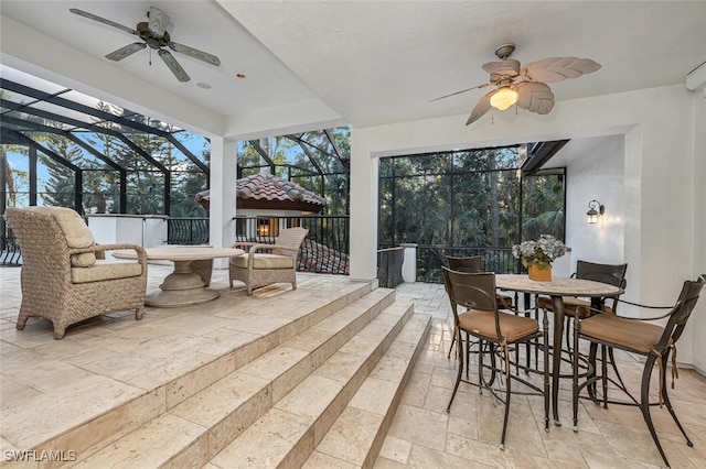 sunroom with ceiling fan