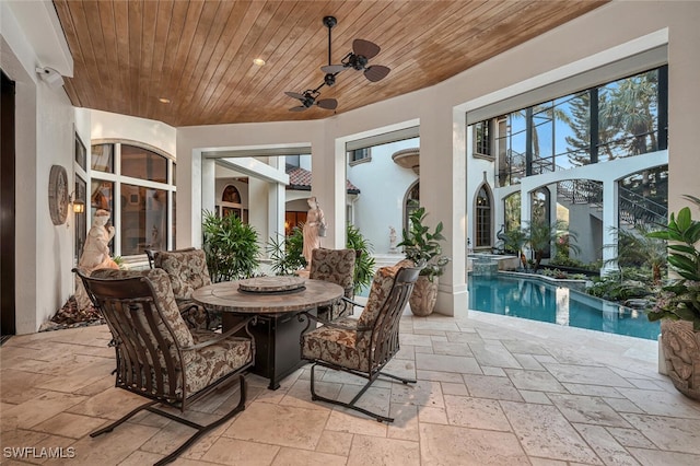 view of patio featuring ceiling fan