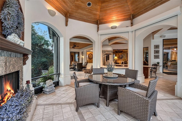 interior space featuring wood ceiling and a premium fireplace