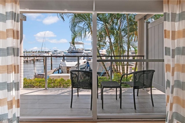 doorway to outside with a water view