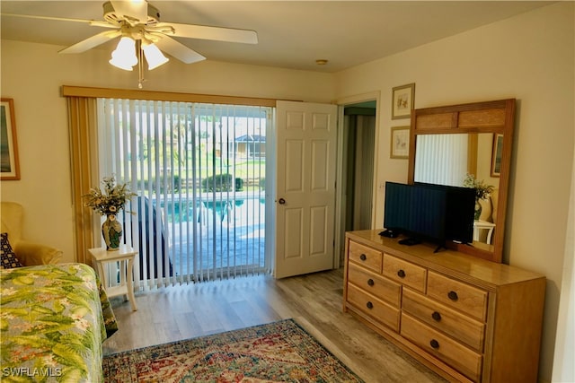 bedroom with access to outside, light hardwood / wood-style floors, and ceiling fan