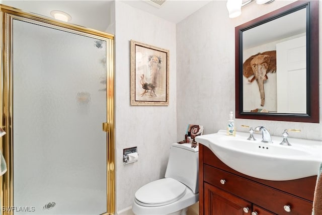 full bathroom featuring toilet, vanity, and a shower stall