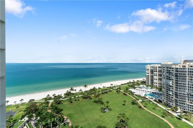 drone / aerial view featuring a water view and a view of the beach