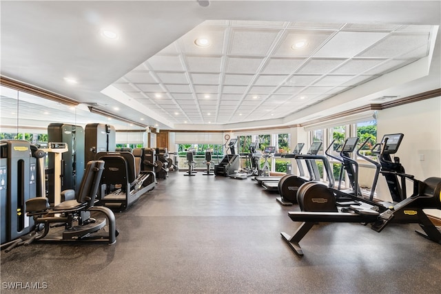 exercise room featuring coffered ceiling