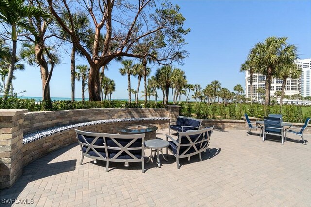 view of patio with a fire pit