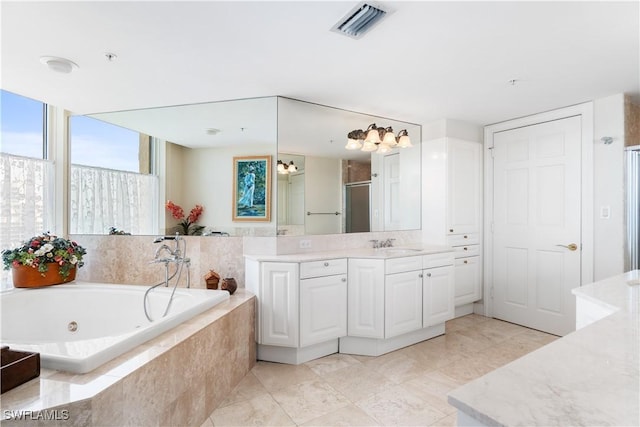bathroom with visible vents, a tub with jets, a stall shower, and vanity