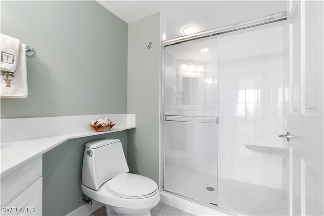 full bathroom featuring toilet, a stall shower, and vanity