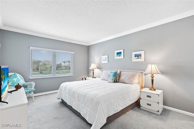 bedroom featuring a textured ceiling, ornamental molding, and light carpet