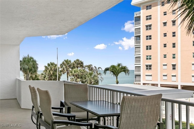 balcony featuring a water view