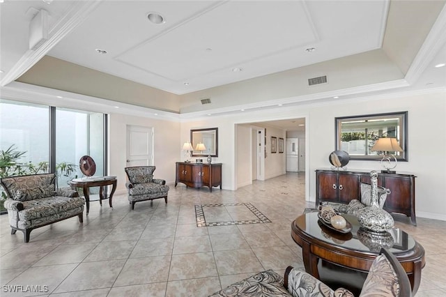 1036 S Collier Blvd Unit 101, Marco Island, FL 34145 - living area with a tray ceiling, plenty of natural light, light tile patterned floors, and crown molding