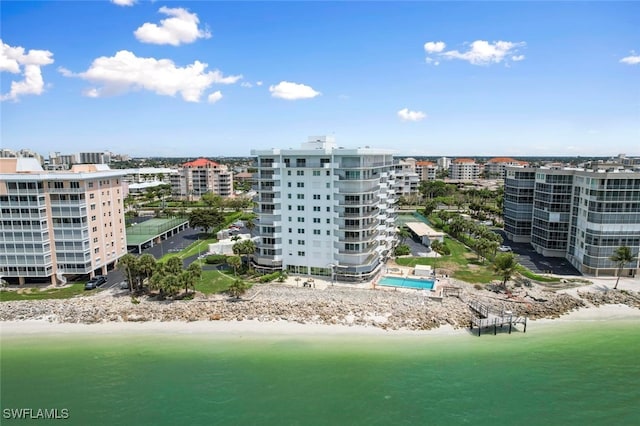 aerial view with a water view and a view of the beach