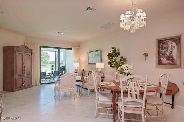 dining space featuring a notable chandelier