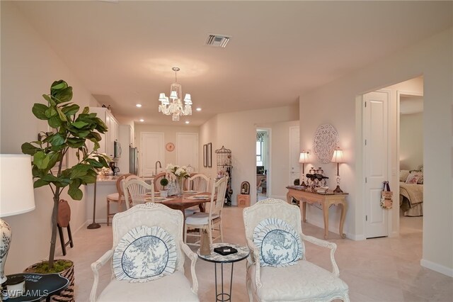 dining area with a notable chandelier