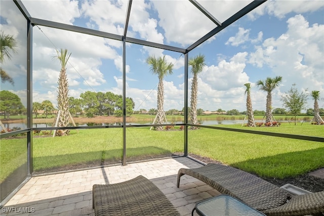 sunroom / solarium with a water view