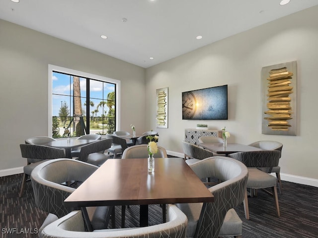 dining space with dark hardwood / wood-style floors