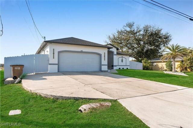 ranch-style home featuring a front yard and a garage