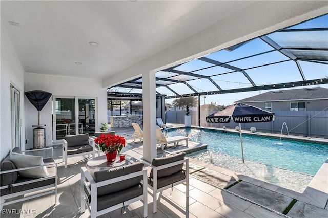 view of swimming pool featuring a lanai, a patio, and pool water feature