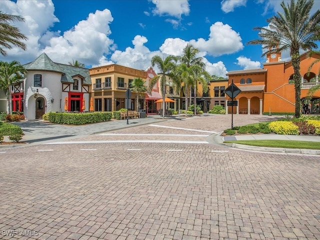 9098 Capistrano St S Unit 7103, Naples, FL 34113 - view of decorative road with curbs and sidewalks
