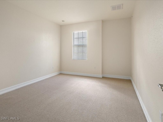 9098 Capistrano St S Unit 7103, Naples, FL 34113 - empty room featuring light colored carpet and baseboards