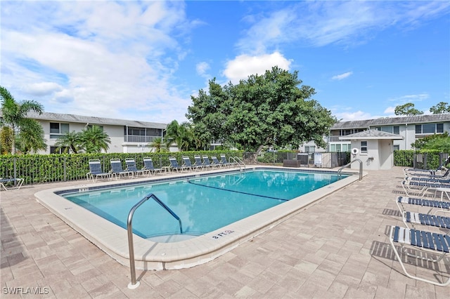 view of swimming pool featuring a patio area