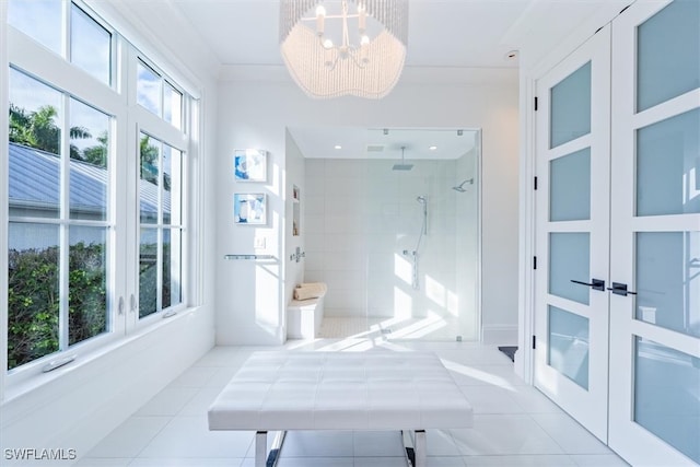 full bath with a chandelier, ornamental molding, tile patterned flooring, and a shower stall