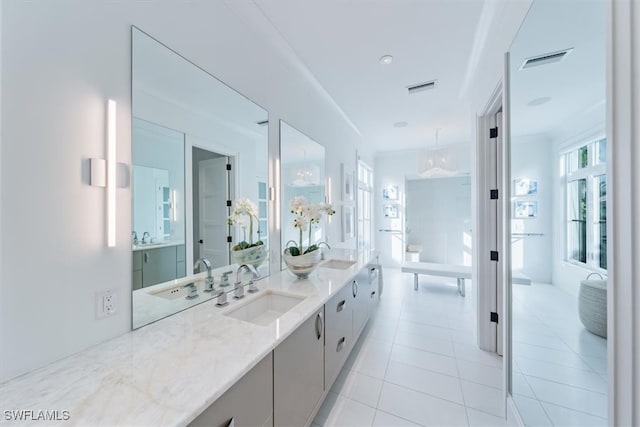 full bath featuring tile patterned flooring, visible vents, and vanity