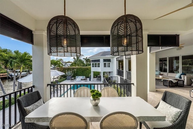 balcony featuring outdoor dining area and a patio