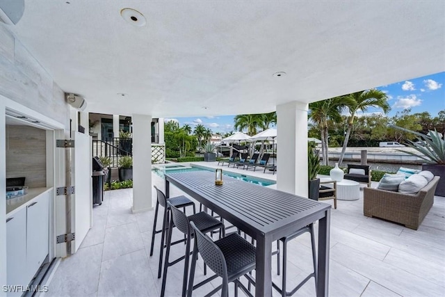 view of patio featuring an outdoor pool