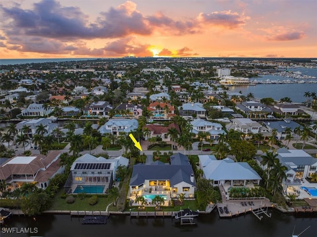 bird's eye view featuring a residential view and a water view