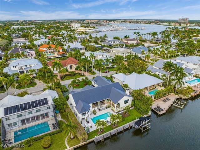 bird's eye view featuring a water view and a residential view