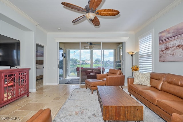 living room with ornamental molding, ceiling fan, and a healthy amount of sunlight