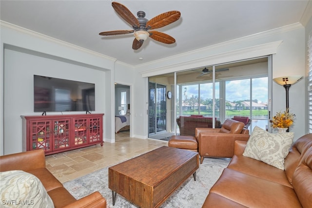 living room with ornamental molding and ceiling fan